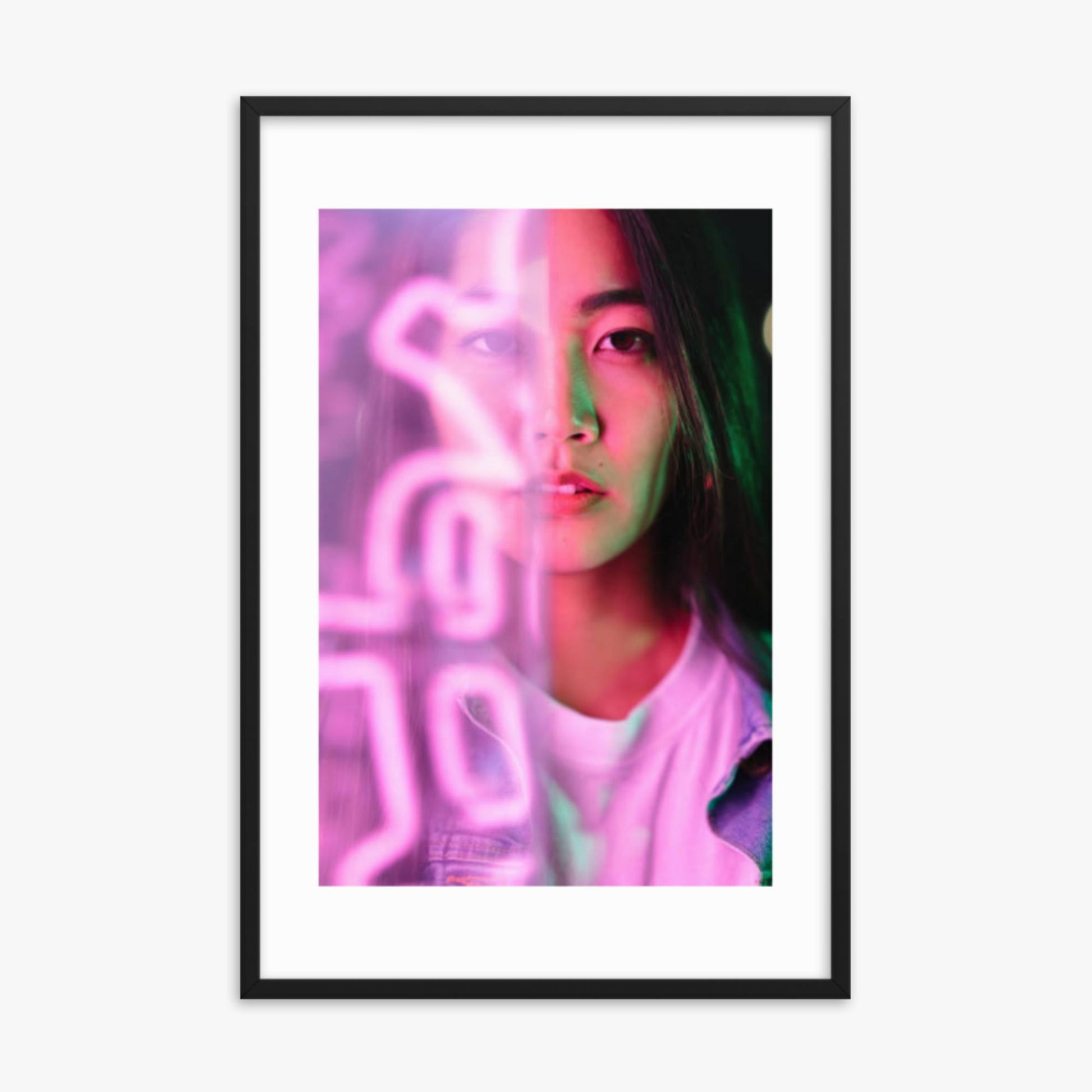 Portrait of young woman lit by pink neon light 24x36 in Poster With Black Frame