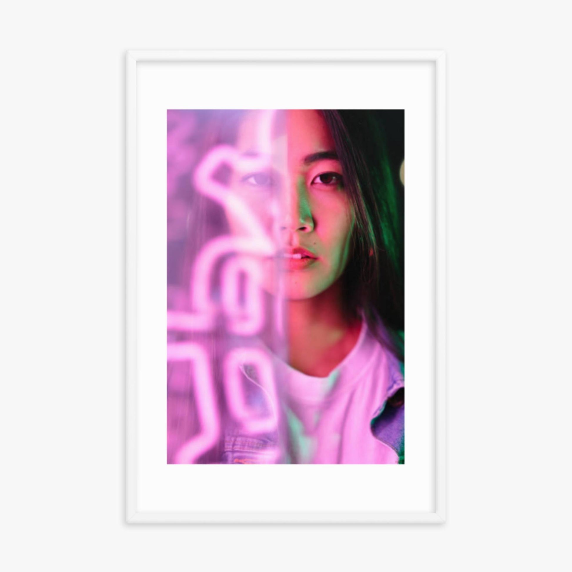 Portrait of young woman lit by pink neon light 24x36 in Poster With White Frame