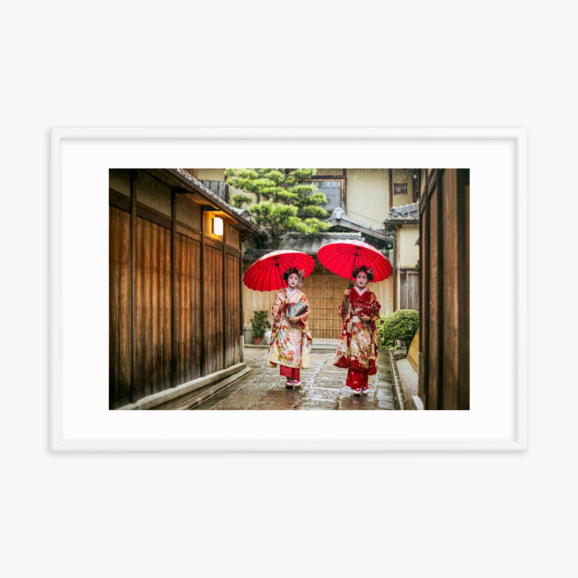 Geishas holding red umbrellas during rainy season 24x36 in Poster With White Frame